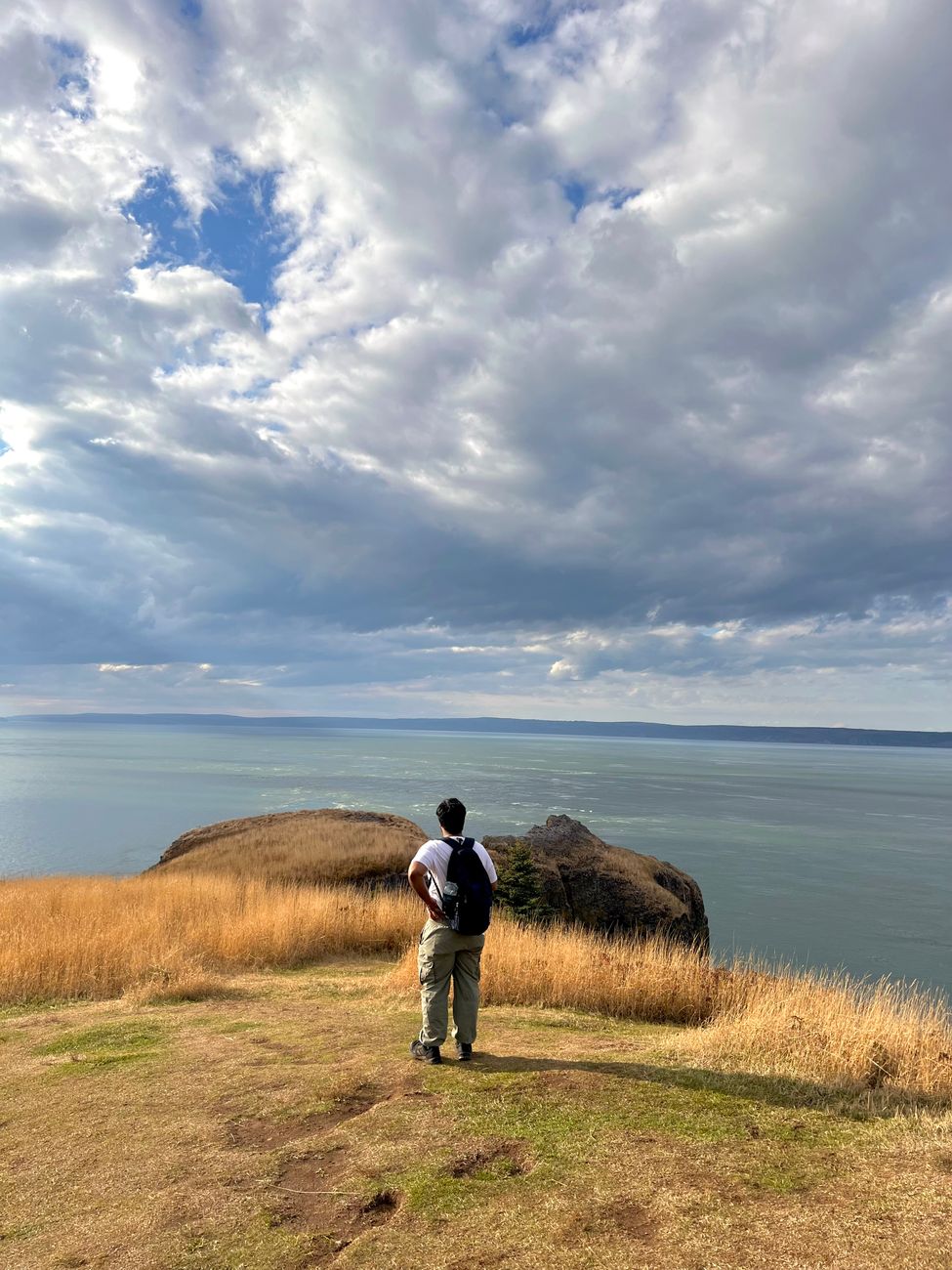 Hiker on the Blomidon cliffs above the Minas Basin, Nova Scotia